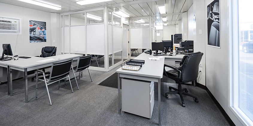 Furnished interior with office desks