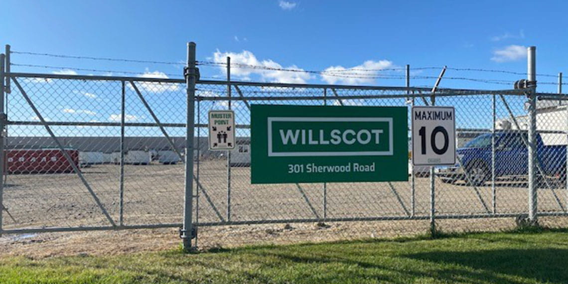 the WillScot sign hanging off the front gate of WillScot Regina office